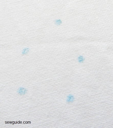 Mark 5 dots on the fabric