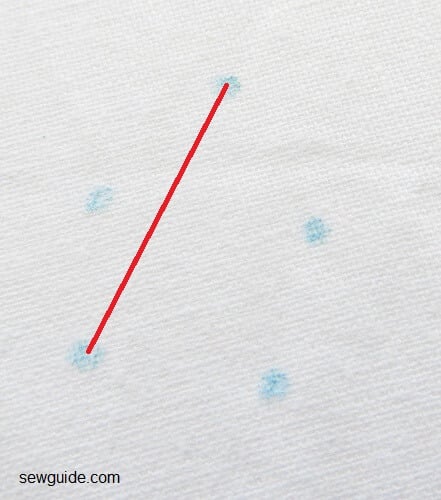 Make straight stitch from top dot to the one on the left bottom