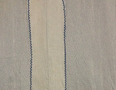 The seam edges finished with a zig zag stitch