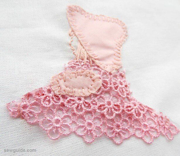 hand applique using lace, embroidery and fabric