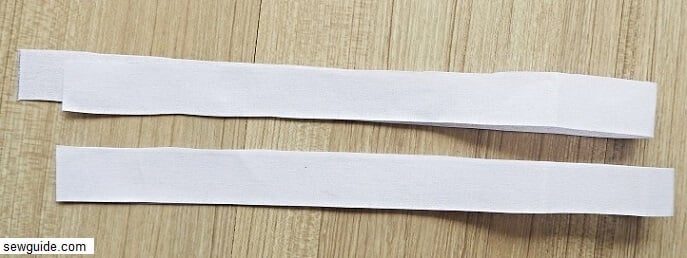 cut out handle pieces -2 interfacing pieces in this dimension - 25 inches long and 1 inch